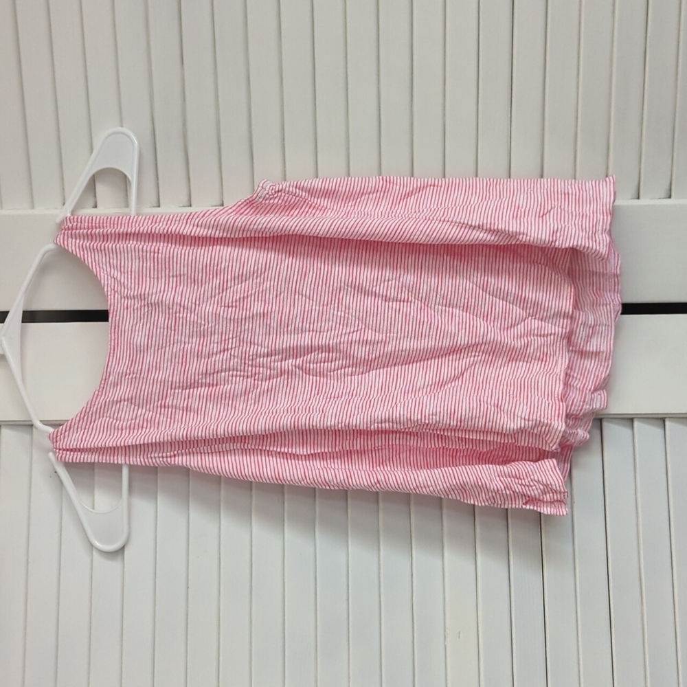 A pink and White stripped tank top with ties in the back